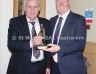 Reserve football manager Cathal Cowan accepts the Reserve Footballer of the year award on behalf of Damian McGaughey from Antrim County Manager Frank Dawso